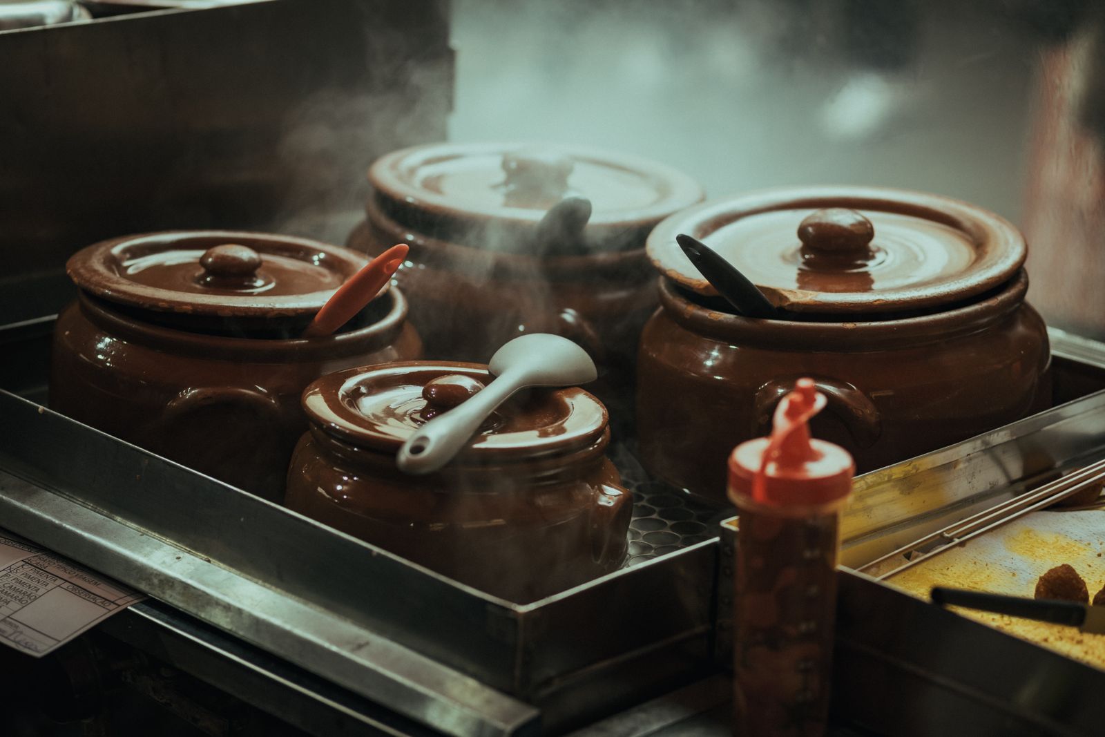 A stock pot at a rolling boil in the prep kitchen